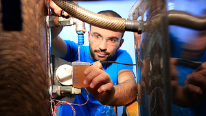 Bastian Etter checks the quality of the stabilised urine, from which fertilizer will be made.